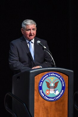The 15th chief of staff of the Air Force Gen. Ronald Fogleman, keynote speaker, speaks during the San Antonio Uniformed Services Health Education Consortium (SAUSHEC) awards and graduation ceremony at the Lila Cockrell Theatre, San Antonio, June 5, 2015. Fogleman flew 315 combat sorties and once to avoid capture clung to the door of AH-1 helicopter while being flown for 20 miles until reaching a safe location. (U.S. Air Force photo by Staff Sgt. Michael Ellis) 