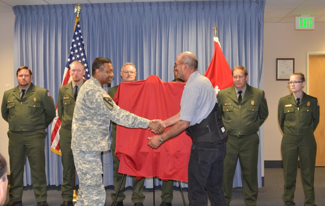 USACE Commanding General Lt. Gen. Thomas Bostick greets former District Park Ranger Alfred Chavez, June 3, 2015. The Corps of Engineers officially and permanently retired Chavez’s park ranger badge from service in recognition of his exceptional courage under fire in a ceremony, June 3, 2015. Watch the video for more details!