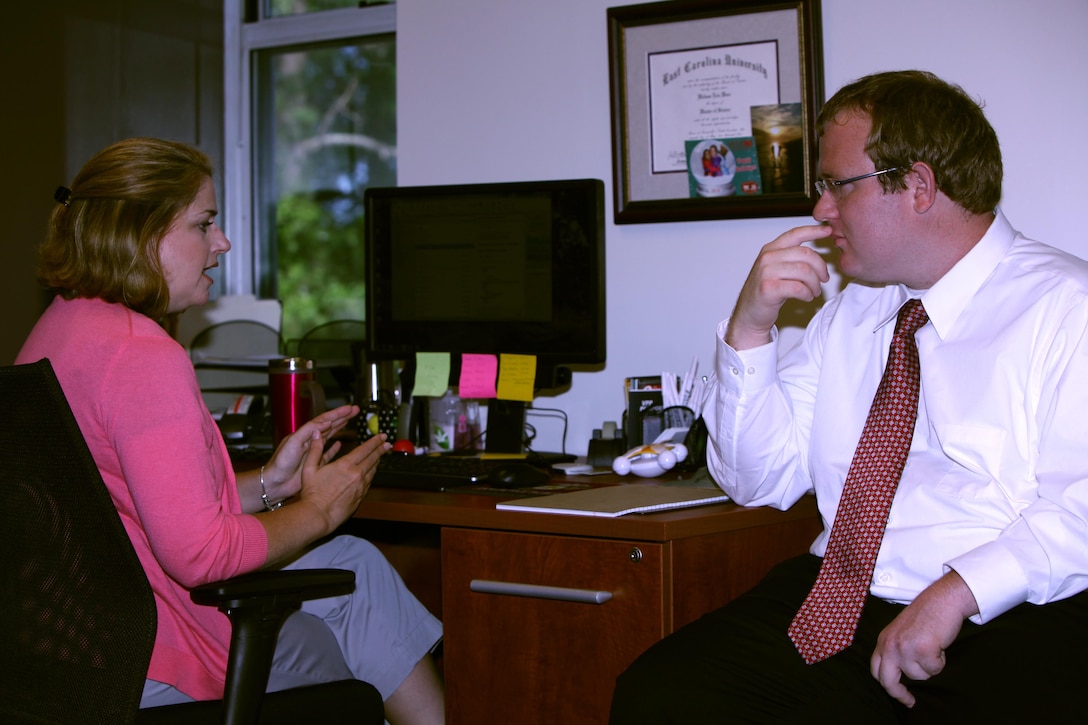 Daniel Fischer, a Protégé Day participant, works with Melissa Johnson during the 3rd annual Protégé Day at Marine Corps Air Station Cherry Point, N.C., June 11, 2015. Johnson is a clinical counselor with the air station. 