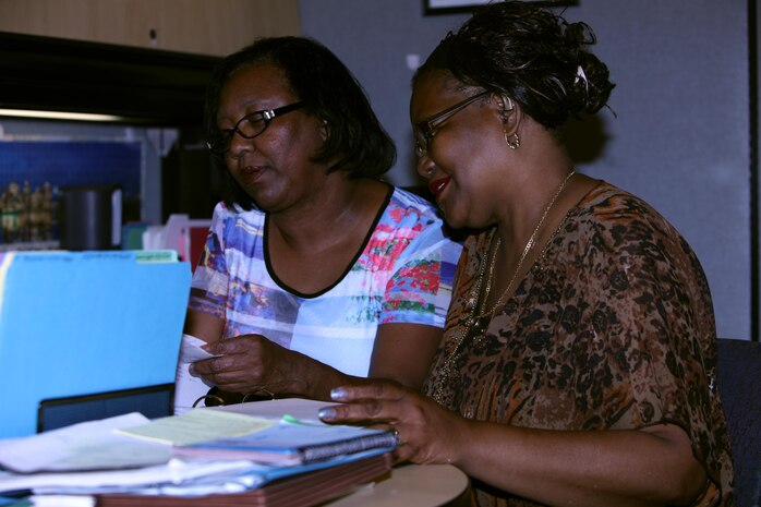 Harriet Hattley, a Protégé Day participant, works with Betsy Windley during the 3rd annual Protégé Day at Marine Corps Air Station Cherry Point, N.C., June 11, 2015. Windley is an inventory management specialist with the air station.