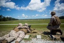 A Marine with Support Company, 8th Engineer Support Battalion, fires an M240B light machine gun at targets ranging from 300-1200 yards during a machine gun range at the Golf 21 range aboard Camp Lejeune, N.C., June 11, 2015. All Marines, no matter their military occupational specialty, need to be proficient with Marine Corps weapon systems to use in any clime or place. (U. S. Marine Corps photo by Cpl. Shawn Valosin)