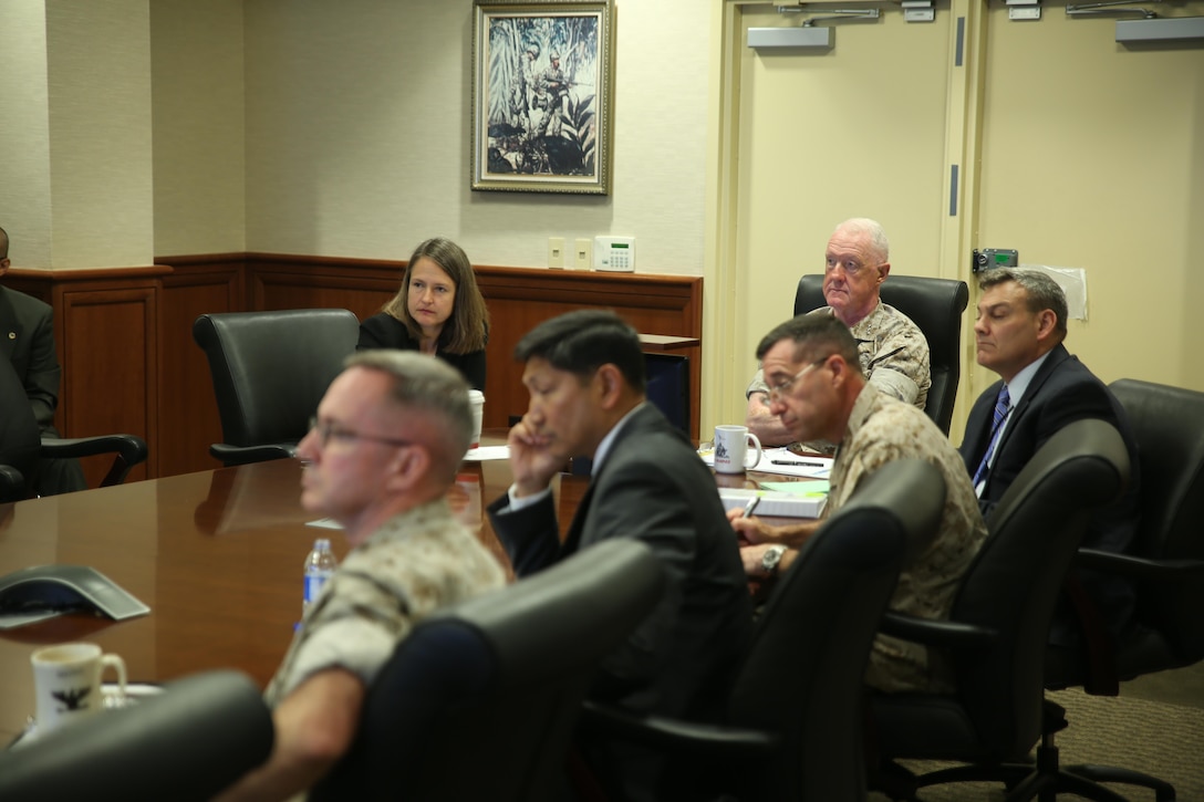 NEW ORLEANS - Lt. Gen. Richard P. Mills, (head of table) commander of Marine Forces Reserve and Marine Forces North, attends a Matlab Hurricane Decision Simulator brief, June 11, 2015, aboard Marine Corps Support Facility New Orleans.  The simulator gives commanders the ability to train for natural disasters, such as hurricanes, giving them the immediate outcome of decisions they could have to make before, during and after a natural disaster. (U.S. Marine Corps Photo by Cpl. J. Gage Karwick/Released)  