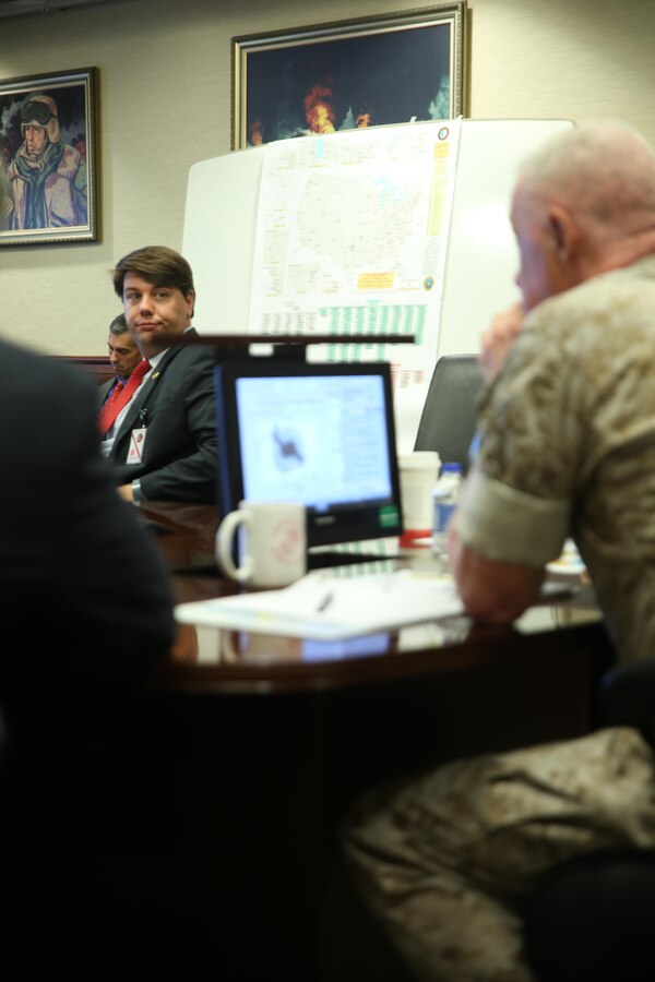 NEW ORLEANS - Aaron Miller, (left) deputy director of the Office of Homeland Security and Emergency Preparedness, listens to questions posed by Lt. Gen. Richard P. Mills, commander of Marine Forces Reserve and Marine Forces North during the Matlab Hurricane Decision Simulator presentation, June 11, 2015, at Marine Corps Support Facility New Orleans. The project also delivers a web-based version of the hurricane decision simulator.  This version will enable several members of the MFR staff to use the program and possibly incorporate it in annual staff training. (U.S. Marine Corps Photo by Cpl. J. Gage Karwick/Released)    