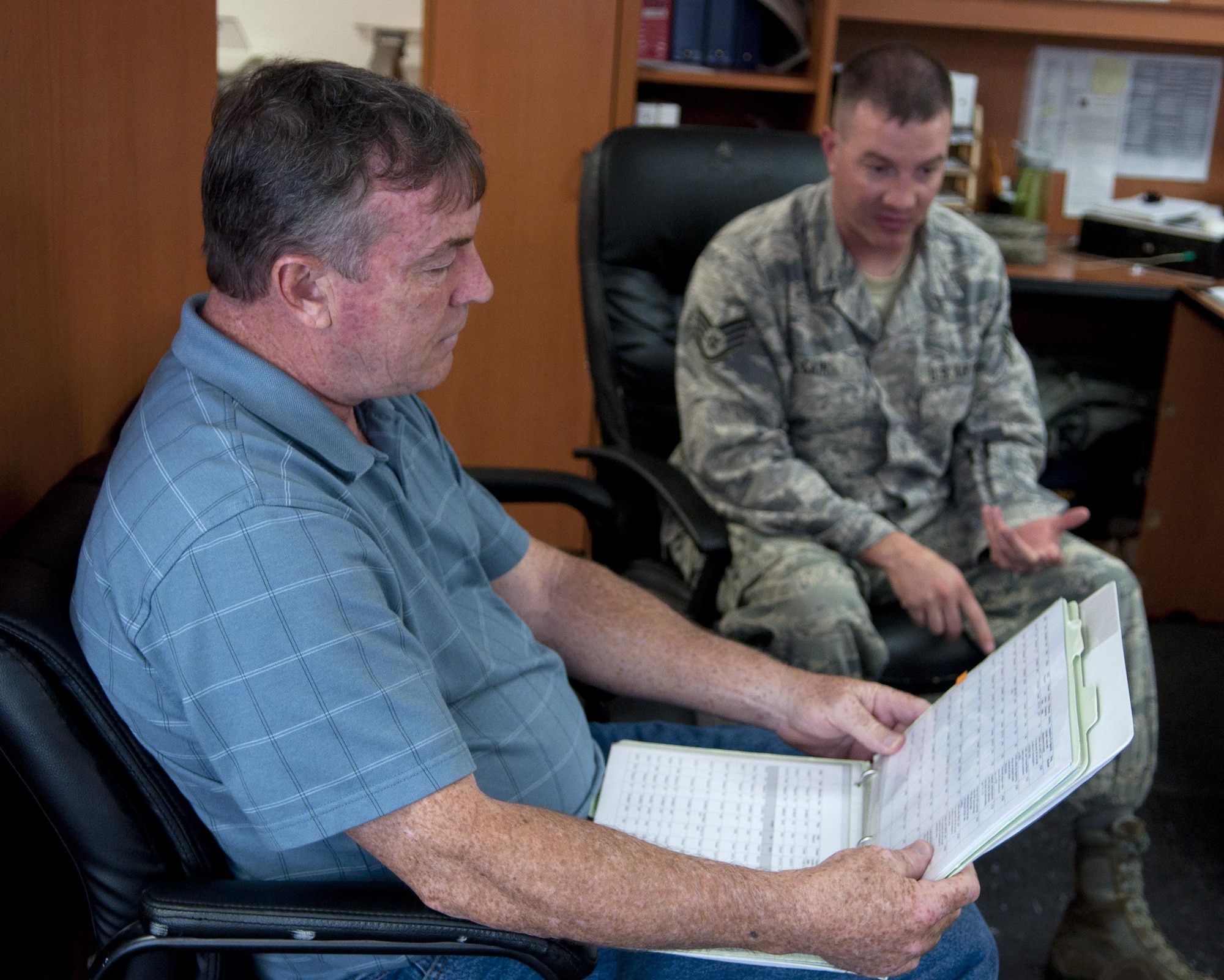 Richard Mullee, the 90th Missile Wing Safety Office missile safety superintendent, reviews the 90th Missile Maintenance squadron checklists during an annual weapons safety inspection June 9, 2015, on F.E. Warren Air Force Base, Wyo. The office reviews checklists and guidance to assist Airmen on the job, while remaining safe in their work environment. (U.S. Air Force photo/Airman 1st Class Malcolm Mayfield)