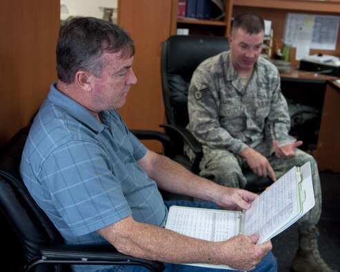 Richard Mullee, the 90th Missile Wing Safety Office missile safety superintendent, reviews the 90th Missile Maintenance squadron checklists during an annual weapons safety inspection June 9, 2015, on F.E. Warren Air Force Base, Wyo. The office reviews checklists and guidance to assist Airmen on the job, while remaining safe in their work environment. (U.S. Air Force photo/Airman 1st Class Malcolm Mayfield)