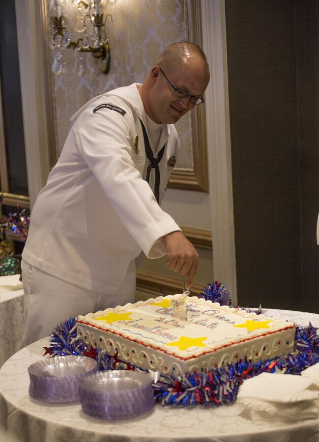 Petty Officer 1st Class Ronald Norris, Naval Air Station Joint Reserve Base New Orleans’ leading security department petty officer, cuts the cake at the New Orleans Chef’s Salute to Our Armed Forces event hosted by the Navy League at the Bourbon Orleans Hotel, June 11, 2015, where he was recognized as Sailor of the Quarter. For five years, chefs around New Orleans have shown support for America’s military by serving their specialty entrees to veterans free of charge, and by recognizing the enlisted service members of the year for each respective branch of the U.S. armed forces. 