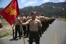 Marines and Sailors with 1st Battalion, 1st Marine Regiment, 1st Marine Division, fall into formation in preparation for a pass in review during a change of command ceremony for their battalion. Lt. Col. Lance A. Jackola relinquished his command and entrusted the well-being and professional development of his Marines to Lt. Col. Steven M. Sutey. (U.S. Marine Corps photo by Cpl. Carson A. Gramley/Released)