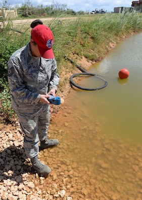 Tech. Sgt. Roshia Johari, the 554th RED HORSE NCO in charge of water and fuels systems maintenance contingency training, uses an ultrameter to test the quality of a water source June 9, 2015, at Andersen Air Force Base, Guam. The Reverse Osmosis Water Purification Unit’s purification process starts with finding a viable water source, which could be fresh, brackish or saltwater. (U.S. Air Force photo/Airman 1st Class Joshua Smoot)