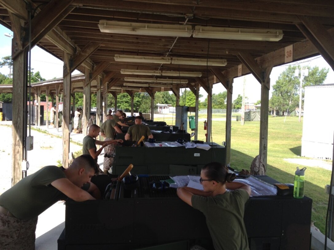 Marines from BEEEST 5-15 conduct a practical application on generator schematics and troubleshooting.