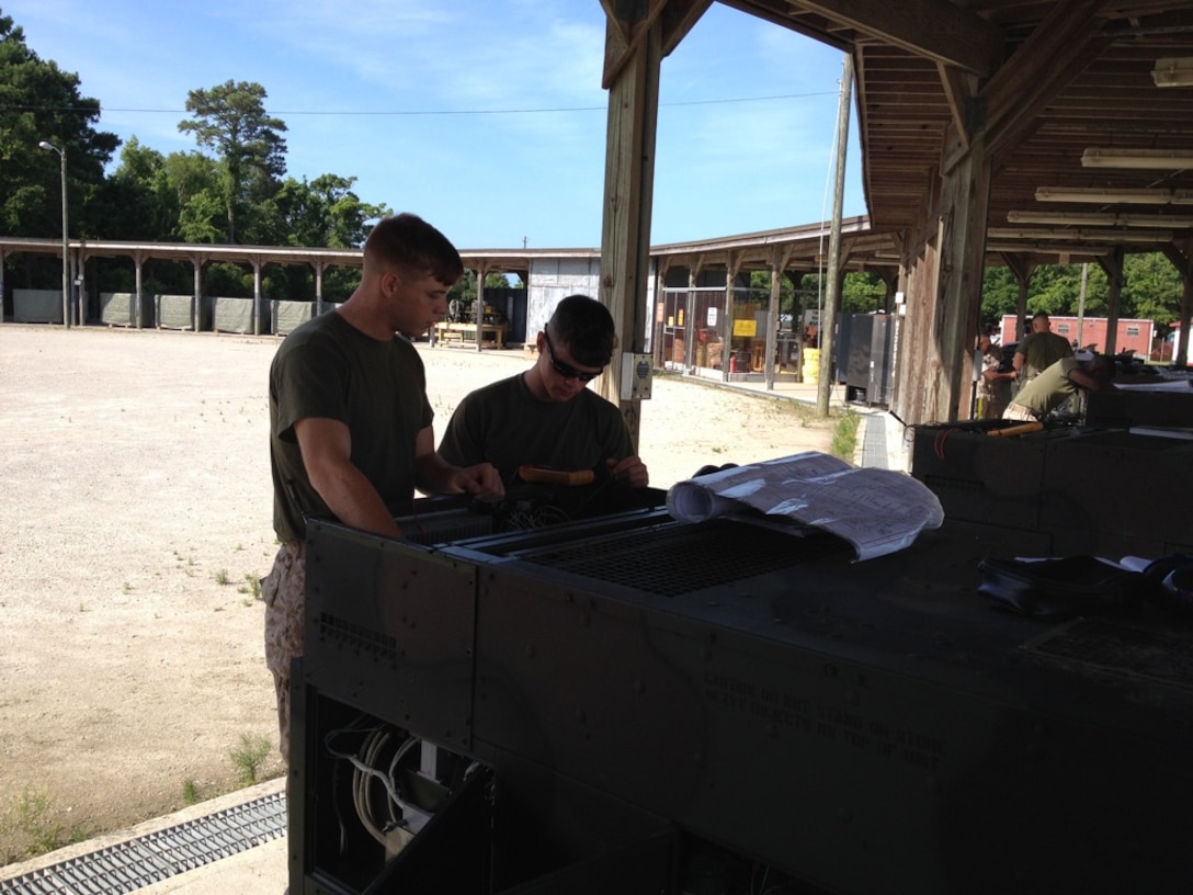 Marines from BEEEST 5-15 conduct a practical application on generator schematics and troubleshooting.