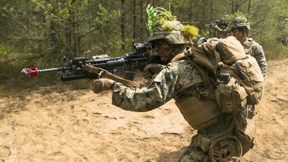 Lithuanian forces are teamed with U.S. Marines from the Black Sea Rotational Force during Exercise Saber Strike at the Pabrade Training Area, Lithuania, June 9, 2015.  The exercise brings NATO allies and other partner nations together in eastern Europe for a multilateral training event designed to promote regional stability and security, strengthen partnerships, and foster trust. 