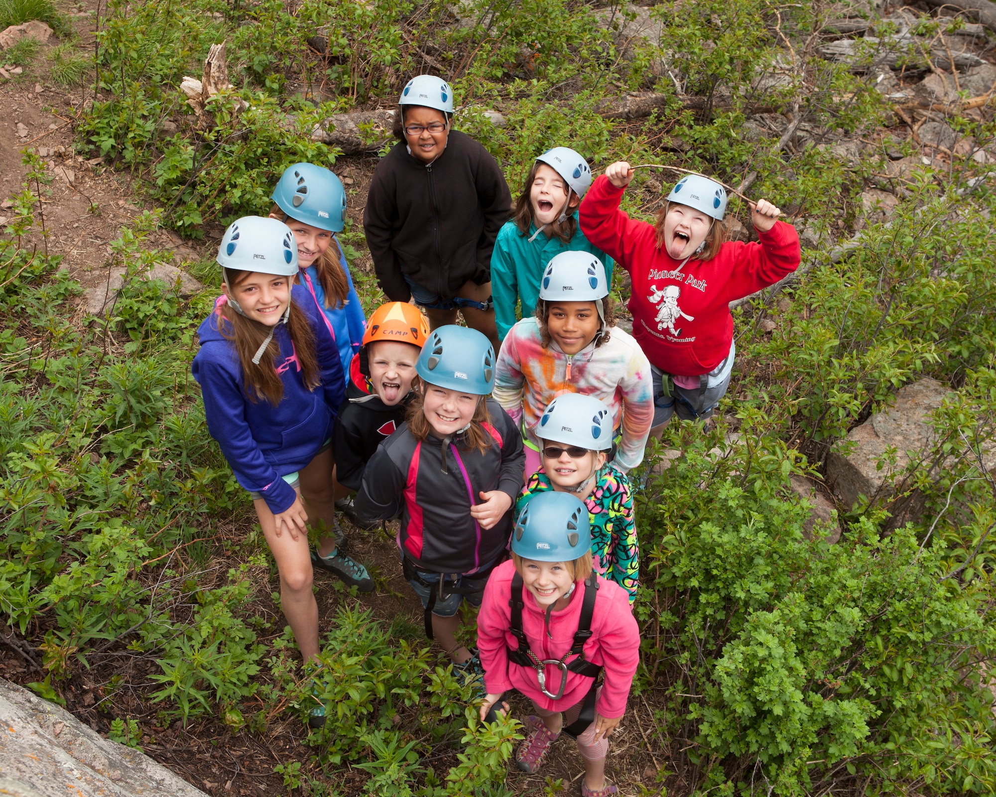 Children from F.E. Warren Air Force Base participating in Outdoor Recreation's Basic Recreation Adventure Training Camp pose for a group photo at the Vedauwoo Recreation Area in Medicine Bow National Forest, Wyo., June 10, 2015. The children were rock climbing that day. (U.S. Air Force photo by Lan Kim)