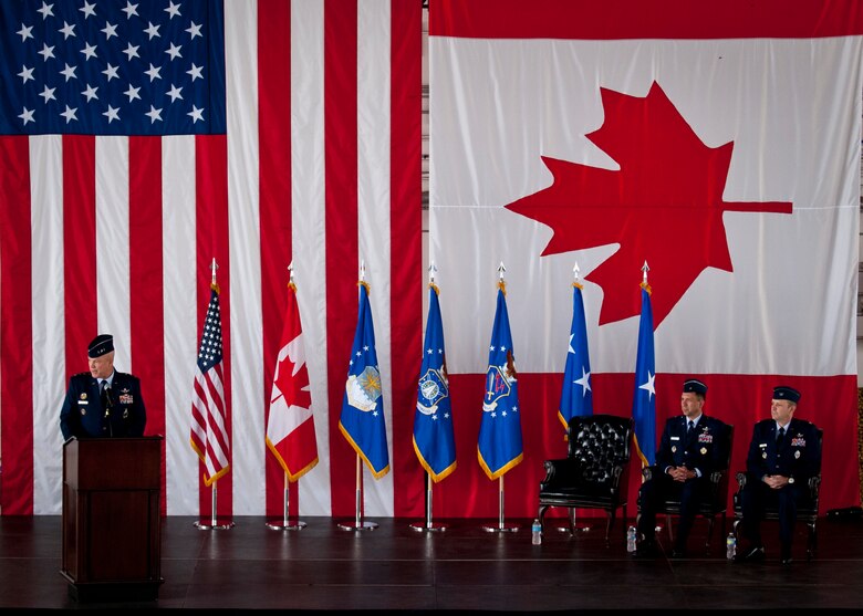 PETERSON AIR FORCE BASE, Colo. – Lt. Gen. John W. “Jay” Raymond, commander, 14th Air Force (Air Forces Strategic) and Joint Functional Component Command for Space gives remarks during the 21st Space Wing change of command ceremony June 12 in hangar 140. Before taking command of the wing, Col. Douglas A. Schiess was Director of Space Forces, U.S. Air Forces Central Command, U.S. Central Command.  (U.S. Air Force photo/Staff Sgt. J. Aaron Breeden)
