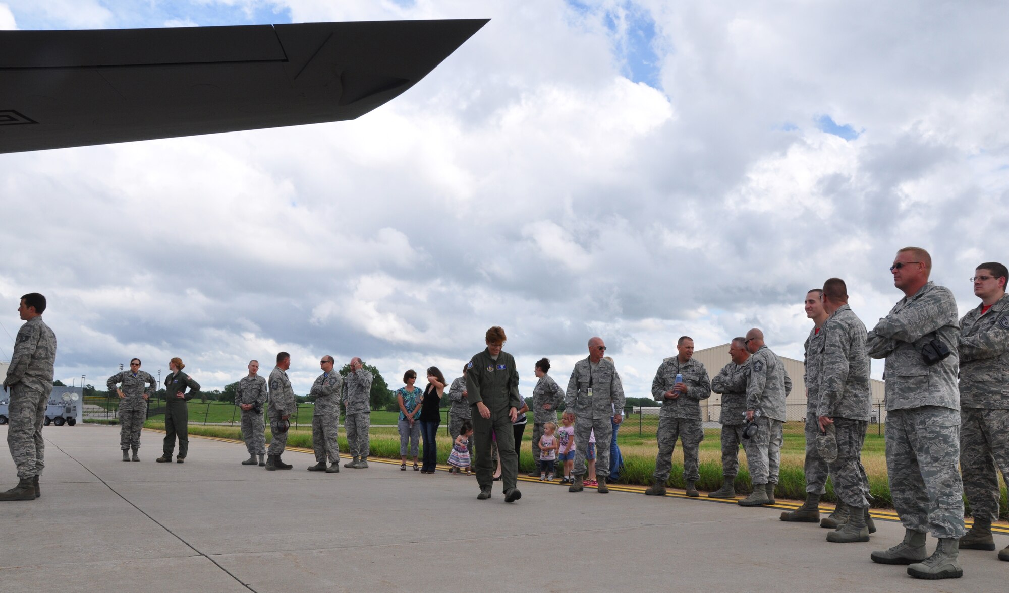Family members and leaders of the 931st Air Refueling Group gather before greeting returning Airmen, June 12, 2015, at McConnell Air Force Base, Kan. More than 20 members of the 931 ARG returned after a deployment to Southwest Asia.  (U.S. Air Force photo by Tech. Sgt. Abigail Klein)