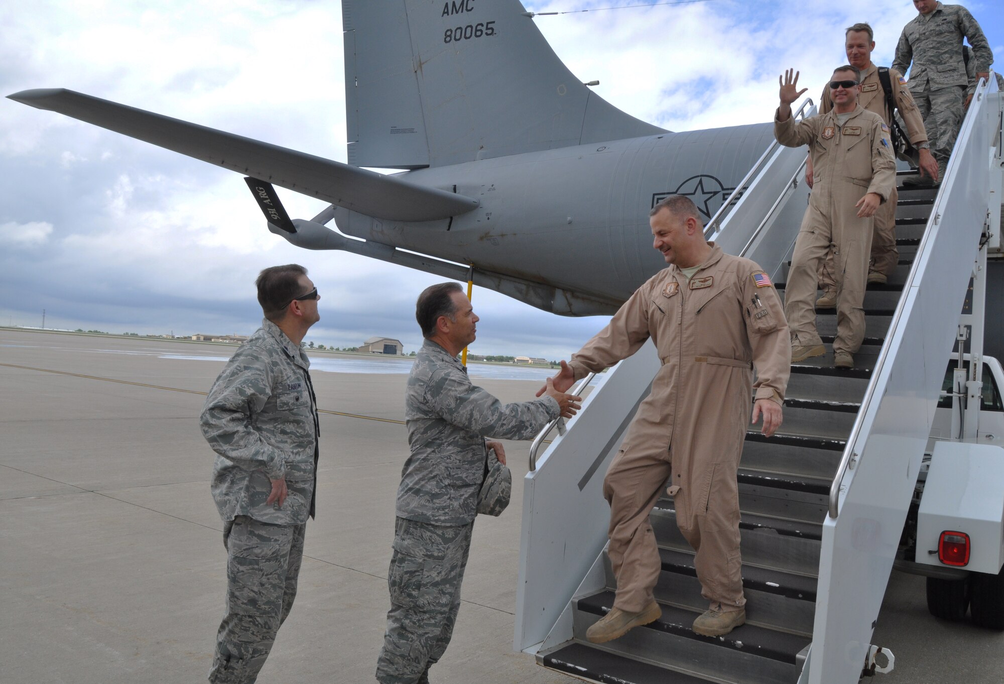 McConnell leaders greet more than 20 members of the 931st Air Refueling Group as they return from a deployment to Southwest Asia, June 12, 2015, at McConnell Air Force Base, Kan. During the deployment, the 931 ARG performed aircraft maintenance and filled other support roles.  (U.S. Air Force photo by Tech. Sgt. Abigail Klein)