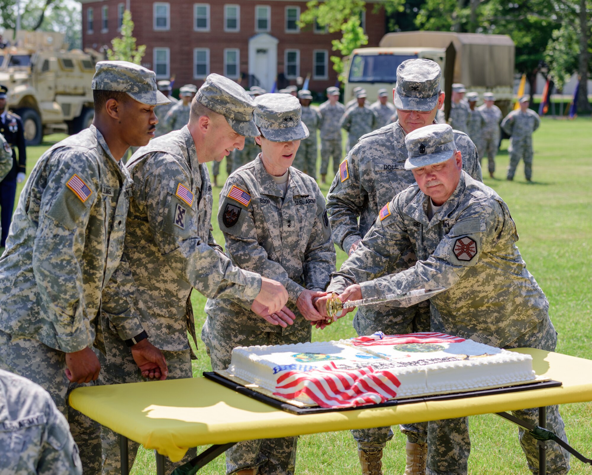 First Sgt. Charles Beck and Spc. Courtney Williams, the unit’s oldest and youngest Soldiers respectively, ceremonially cut the Army birthday cake during a celebration at Sharp Field, Joint Base McGuire-Dix-Lakehurst, N.J. June 10, 2015. Soldiers celebrated their 240th birthday during the celebration. (U.S. Air Force photo by Robert Williard/RELEASED)