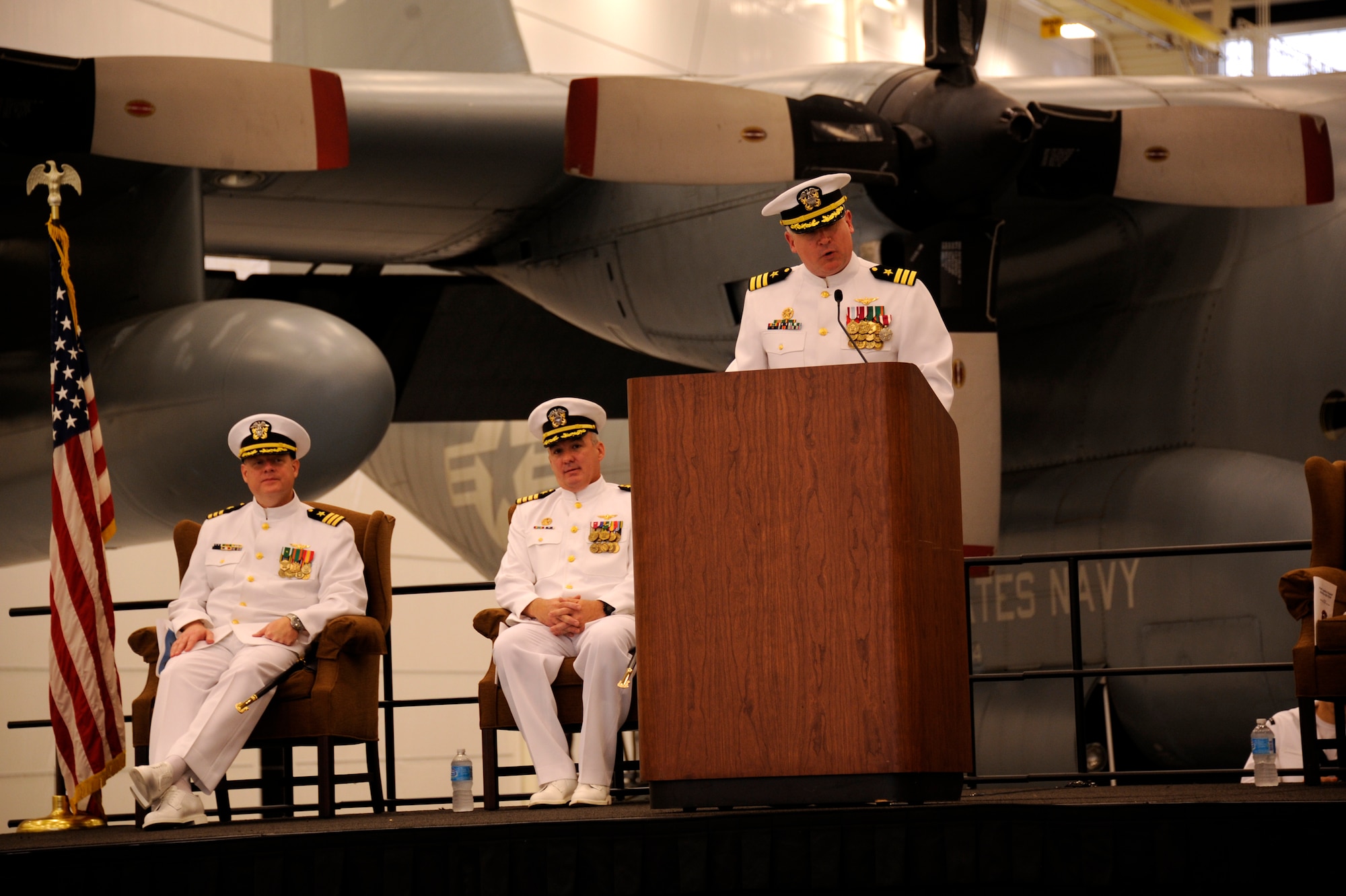 Navy Cmdr. Todd Boland, outgoing commander and Weehawken, N.J. native, delivers his final remarks to an audience of more than 300 shipmates, families and guests at the Fleet Logistics Support Squadron 64 change of command ceremony held June 6, 2015, on Joint Base McGuire-Dix-Lakehurst, N.J. VR-64 is one of 15 Navy VR squadrons and one of five C-130T Hercules units. The ceremony was a formal farewell to Boland as the unit welcomed Navy Cmdr. Peter Moore. (U.S. Air Force photo by Pascual Flores/Released)