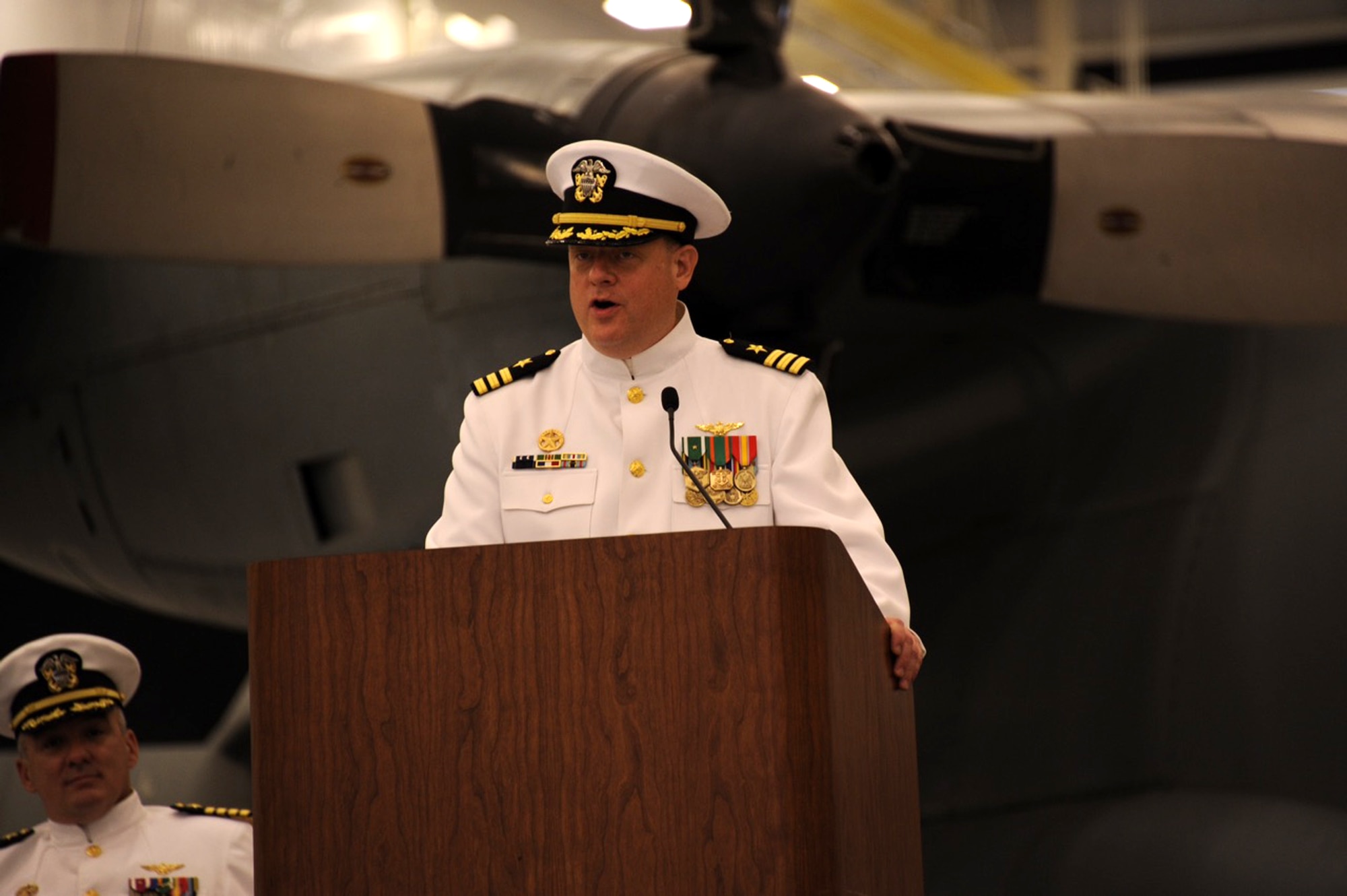 Navy Cmdr. Peter Moore, a Yardley, Pa. native, assumed command of Fleet Logistics Support Squadron 64 (VR-64) during a change of command ceremony held June 6, 2015, on Joint Base McGuire-Dix-Lakehurst, N.J. VR-64 is one of 15 Navy VR squadrons and one of five C-130T Hercules units. The ceremony was a formal farewell to Navy Cmdr. Todd Boland as the unit welcomed Moore. (U.S. Air Force photo by Pascual Flores/Released)