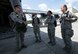U.S. Air Force Staff Sgt. Steven Trimble, left, 820th Combat Operations Squadron jumpmaster, speaks with U.S. Air Force Academy cadets before an HC-130J Combat King II flight June 5, 2015, at Moody Air Force Base, Ga. Members of the 820th Base Defense Group performed a static-line jump for the cadets to see. (U.S. Air Force photo by Airman 1st Class Dillian Bamman/Released)