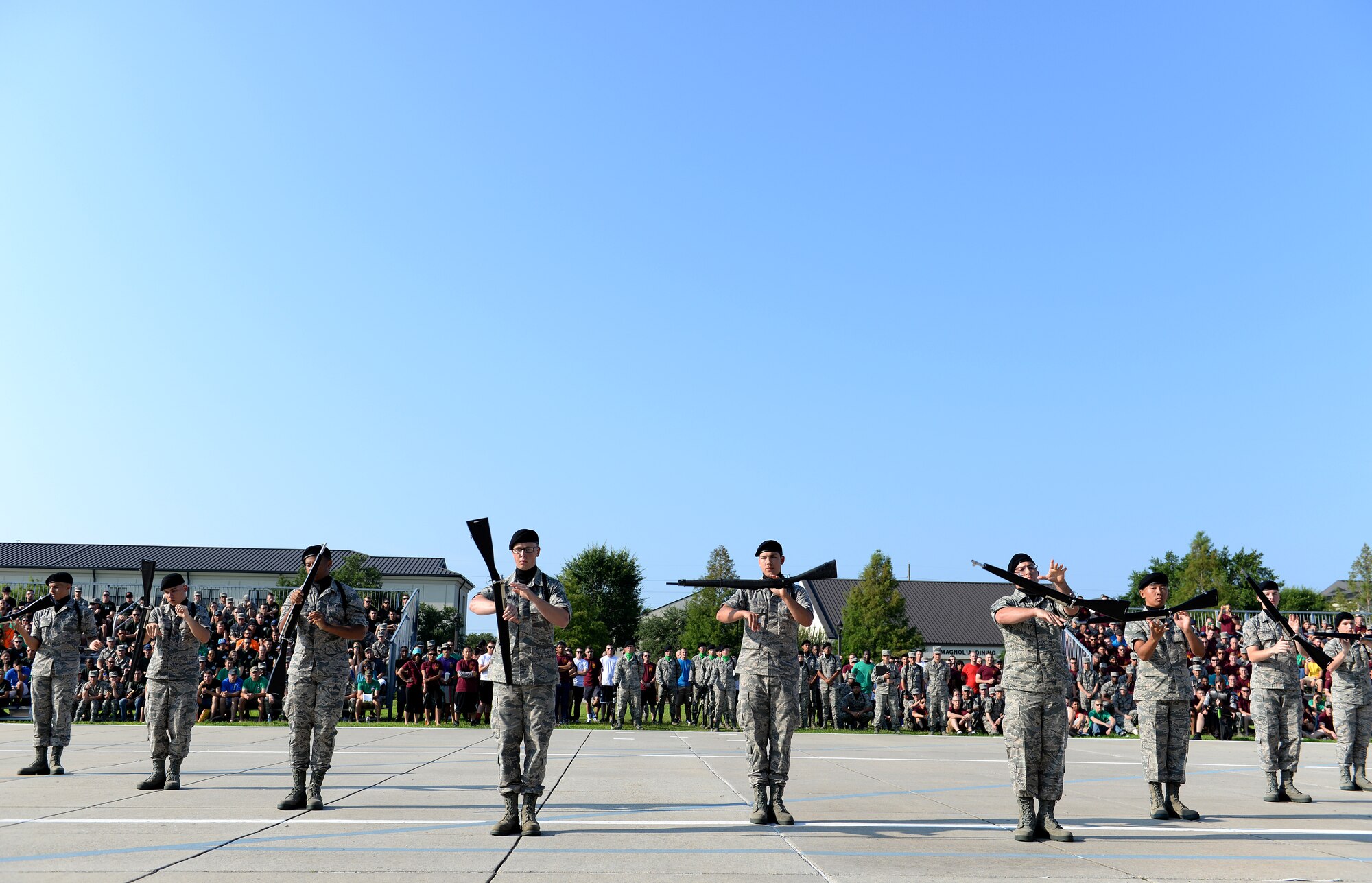 Members of the 338th Training Squadron spin their rifles during the 81st Training Group’s drill down competition June 5, 2015, at the Levitow Training Support Facility drill pad, Keesler Air Force Base, Miss. The 338th TRS “Dark Knights” placed 2nd in open ranks and 3rd in freestyle. (U.S. Air Force photo by Airman 1st Class Duncan McElroy)