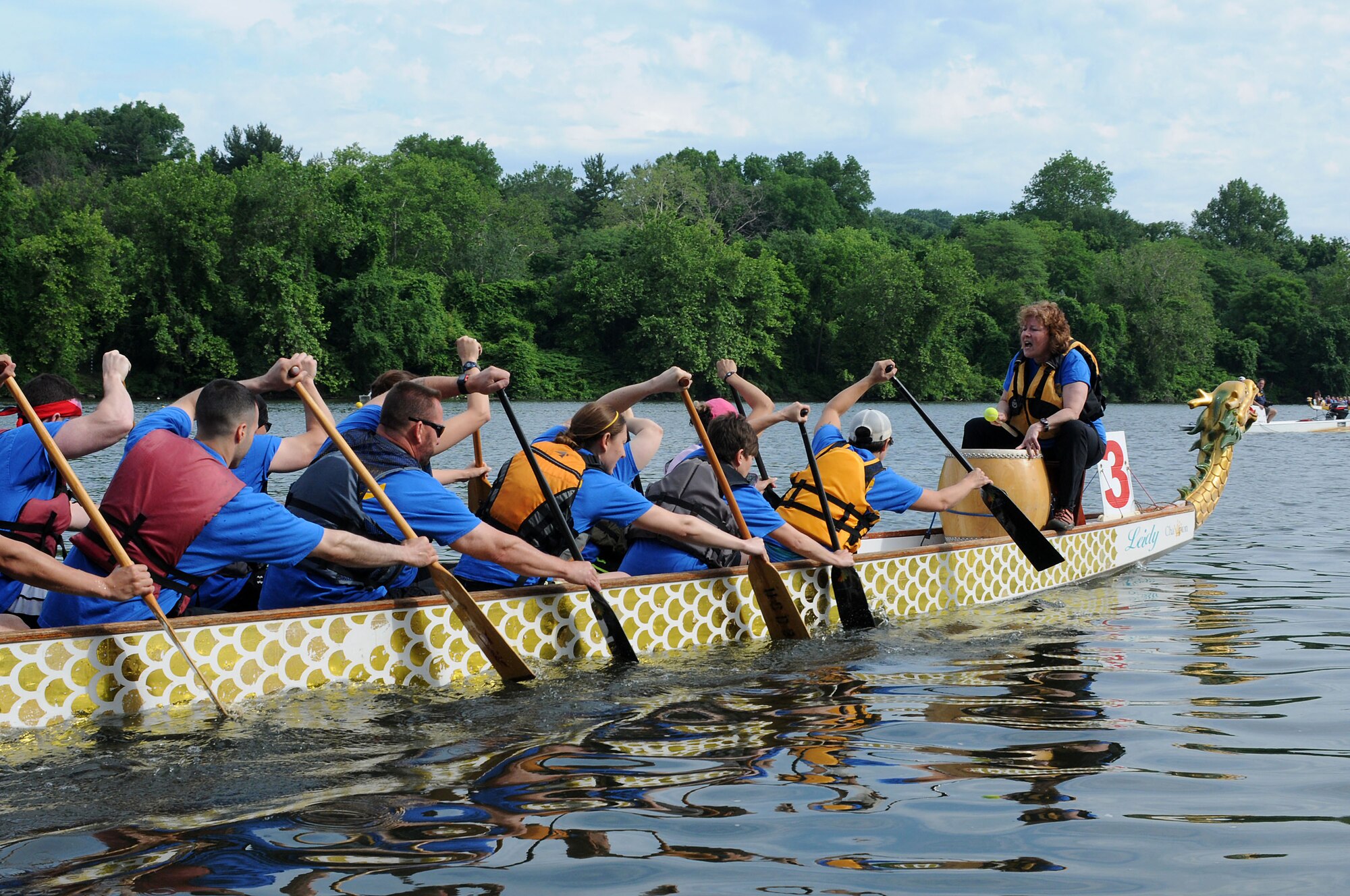 The 111th Argonauts, a dragon boat team comprised of members and affiliates of the 111th Attack Wing at Horsham Air Guard Station, paddle to the tempo of their drummer, Lindy Rustam, during the Independence Dragon Boat Regatta in Philadelphia, June 6, 2015. The dummer for a dragon boat serves to set the speed for the paddlers. (U.S. Air National Guard photo by Tech.Sgt. Andria Allmond/Released)