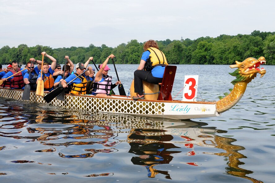 The 111th Argonauts, a dragon boat team comprised of members and affiliates of the 111th Attack Wing at Horsham Air Guard Station, paddle out to the start of the first race during the Independence Dragon Boat Regatta in Philadelphia, June 6, 2015. The team competed without a full boat for all three races. (U.S. Air National Guard photo by Tech.Sgt. Andria Allmond/Released)