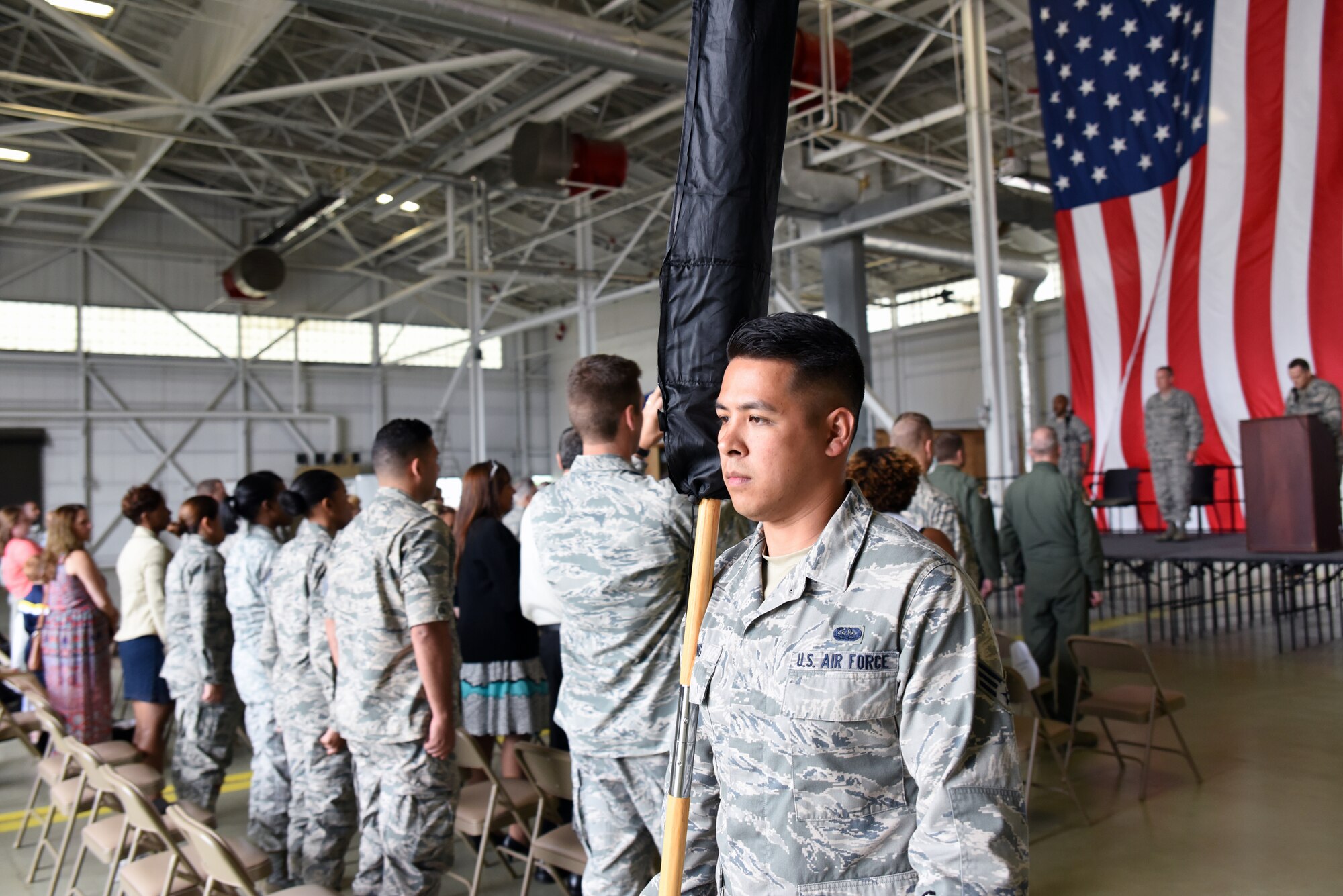 Senior Airman Tam Dang, 42d CBCS, marches the squadron’s cased quidon back to the formation.
