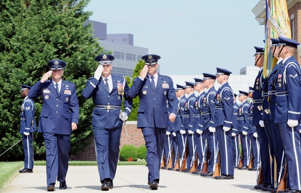 Lt. Col. Timothy Thurston II, left, outgoing U.S. Air Force Honor Guard commander, escorts Maj. Peter Tritsch Jr., center, incoming U.S. Air Force Honor Guard commander, through an inspection of the unit during a change of command ceremony June 12, 2015, at Joint Base Anacostia-Bolling, D.C. The U.S. Air Force Honor Guard provides Air Force veterans with appropriate military honors at Arlington National Cemetery, Va., and other cemeteries in a surrounding five-state region. (U.S. Air Force photo by Senior Airman Preston Webb/Released)