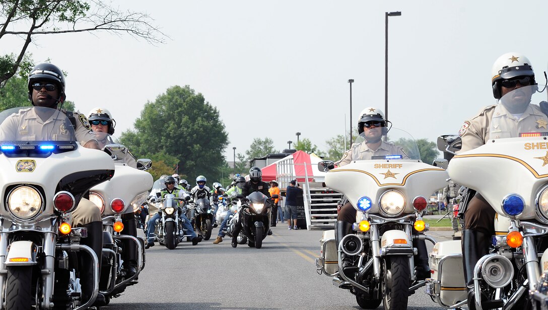 Local law enforcement escorts Team Andrews motorcycle riders on a group ride at the Fifth Annual Motorcycle Safety Day June 11, 2015, at Joint Base Andrews, Md. The ride allowed experienced riders to mentor novice riders and those new to the area. (U.S. Air Force photo by Senior Airman Preston Webb/Released)