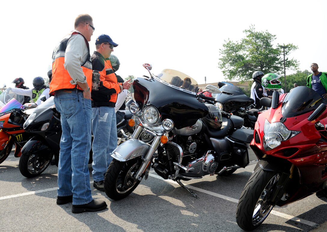 Team Andrews members inspect their motorcycles at the Fifth Annual Motorcycle Safety Day June 11, 2015, at Joint Base Andrews, Md. Performing a comprehensive inspection prior to each ride is crucial to maintaining safety while riding a motorcycle. (U.S. Air Force photo by Senior Airman Preston Webb/Released)