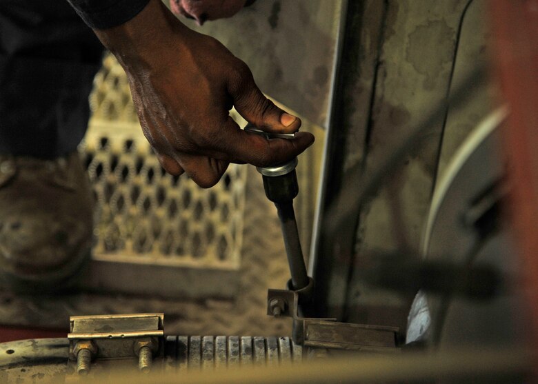 Airman 1st Class Garian Thomas, 92nd Logistics Readiness Squadron fire truck maintainer, performs standard maintenance checks on a fire truck June 8, 2015, at Fairchild Air Force Base, Wash. Standard maintenance checks are necessary to ensure vehicles are operational for mission ready use at all times. (U.S. Air Force photo/Airman 1st Class Taylor Bourgeous)
