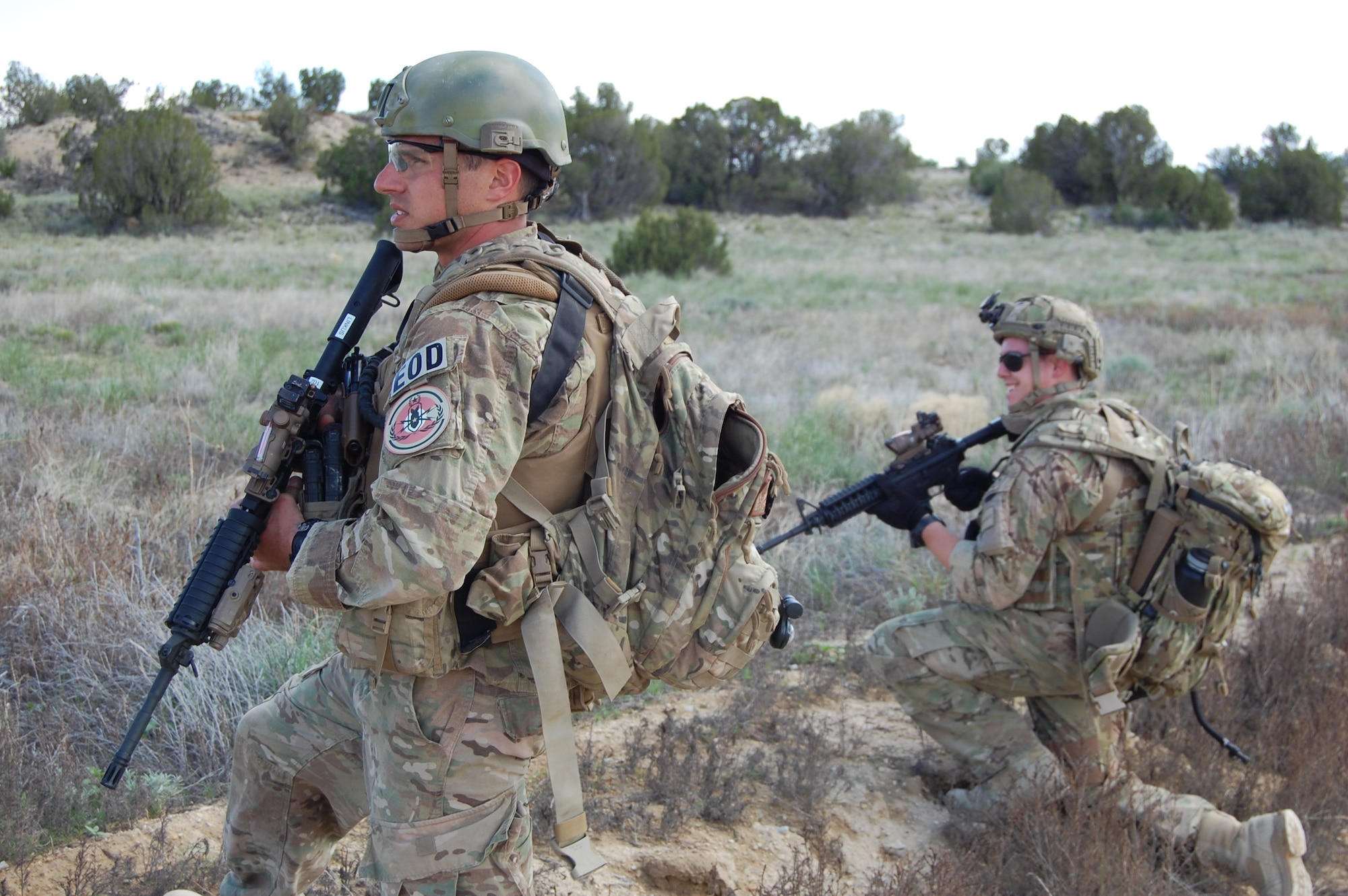 Senior Airman Darrell Linkus and Senior Airman Brandon Ulmer, explosive ordnance disposal operators with the 140th Explosive Ordnance Disposal Flight, 140th Wing, Colorado Air National Guard, practice security techniques during a training exercise at Airburst Range, Ft. Carson, Colo. May 12, 2015.  (Air National Guard photo by Capt. Kinder Blacke)