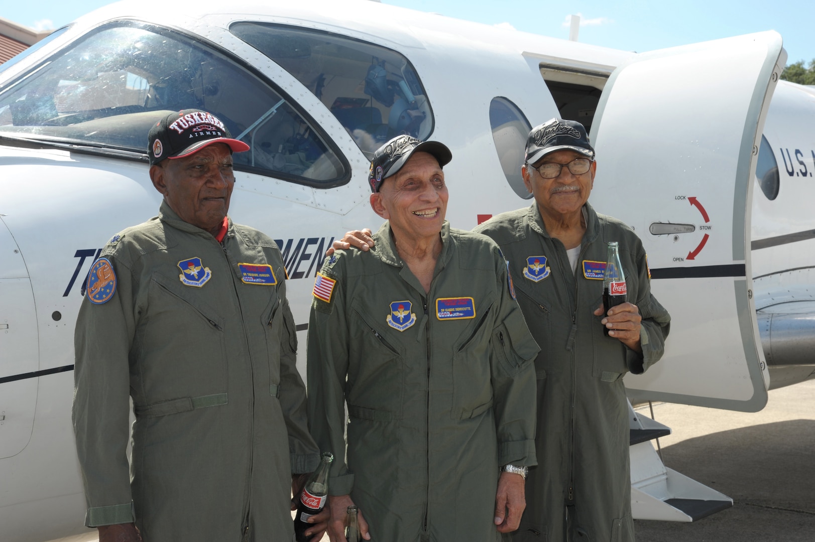 Theodore Johnson, left, Dr. Eugene Derricotte and James Bynum, original Tuskegee Airmen, pose for a photo in front a T-1 Jayhawk aircraft, during the Tuskegee Airmen Tribute 2015, June 11, at Joint Base San Antonio-Randolph. The Tuskegee Airmen were the first African-American military aviators in the United States Armed Forces beginning in World War II.  (U.S. Air Force photo by Joel Martinez)