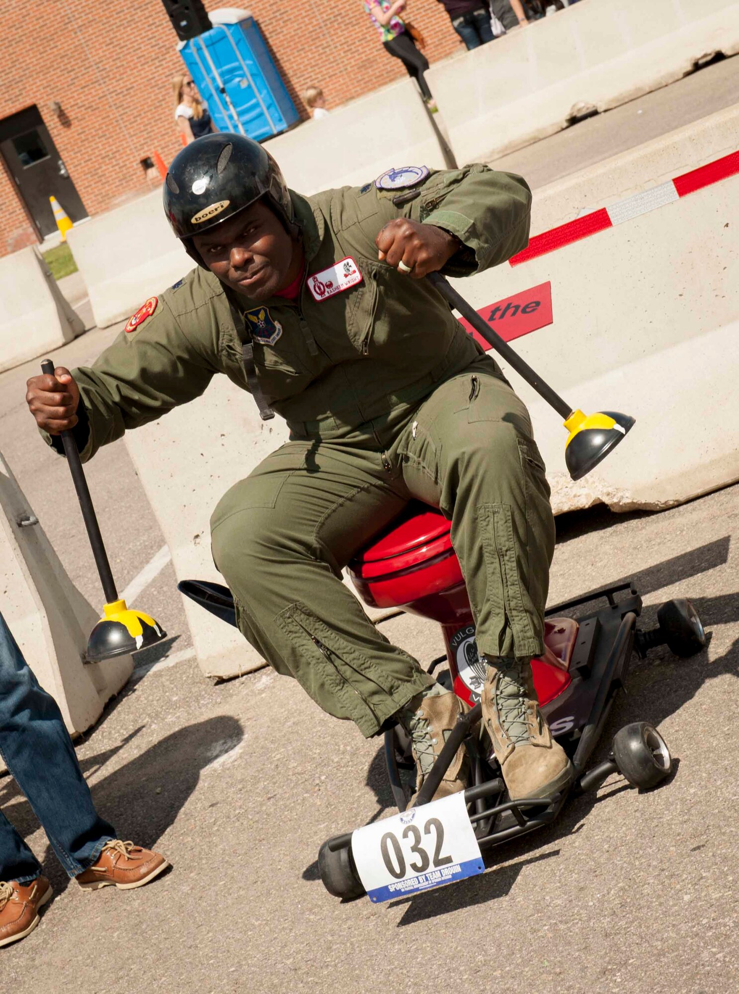 Lt. Col. Rasheem Wright, 740th Missile Squadron commander, sits on his team’s chariot before the Flusher 100 at Minot Air Force Base, N.D., June 5, 2015. The Flusher 100 was a race that consisted of participants creating a racing chariot out of a toilet to compete in the race along with a contest for best decorated chariot.