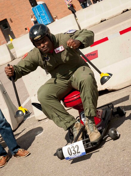 Lt. Col. Rasheem Wright, 740th Missile Squadron commander, sits on his team’s chariot before the Flusher 100 at Minot Air Force Base, N.D., June 5, 2015. The Flusher 100 was a race that consisted of participants creating a racing chariot out of a toilet to compete in the race along with a contest for best decorated chariot.