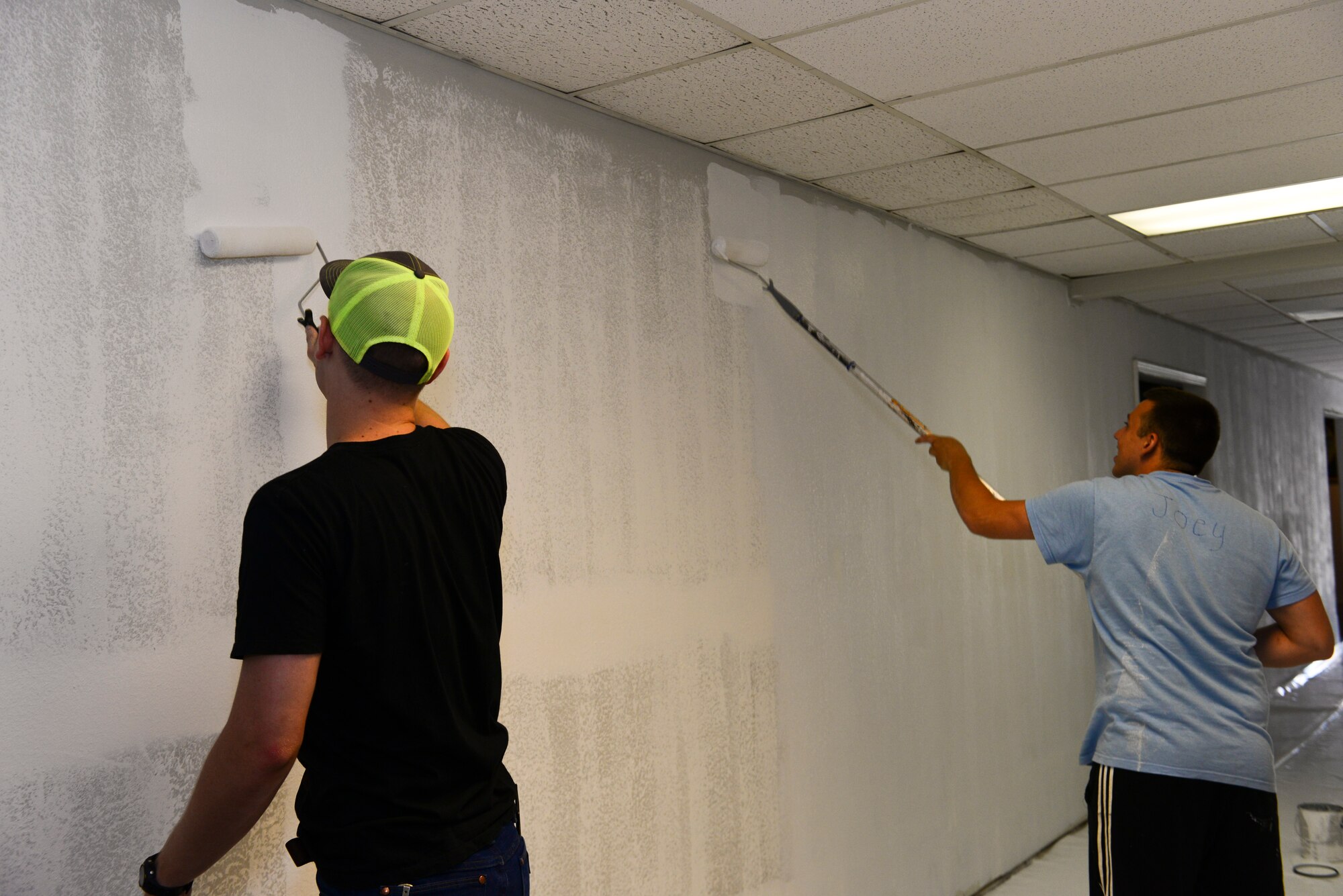Airman 1st Class Derrick Bellomy, left, and Airman 1st Class Austin Tanana, 2nd Operations Support Squadron air traffic controllers, prime the walls of the Global Power Museum on Barksdale Air Force Base, La., June 10, 2015. The museum covers the dynamic history of strategic bombardment at the home of the 2nd Bomb Wing, the 8th Air Force and Air Force Global Strike Command. (U.S. Air Force Photo/Airman 1st Class Luke Hill)