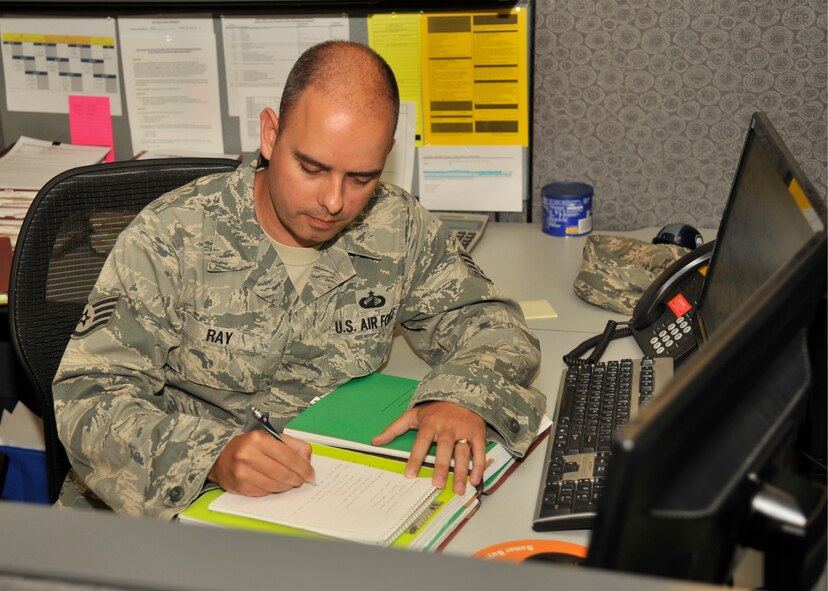 Staff Sgt. Zachery Ray, 92nd Contracting Squadron contract specialist, writes notes for a contract on June 4, 2015, at Fairchild Air Force Base, Wash. Ray purchases supplies and services required for the sustainment of daily operations, his leadership selected him as one of Fairchild’s Finest, a weekly recognition program that highlights top-performing Airmen. (U.S. Air Force photo/Airman 1st Class Taylor Bourgeous)