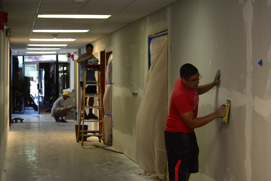 Barksdale Airmen and civilians prepare walls for texturizing and painting at the Global Power Museum on Barksdale Air Force Base, La., June 8, 2015. The Global Power Museum is undergoing renovations to include texturizing and painting the walls and refinishing the floors. (U.S. Air Force Photo/Airman 1st Class Luke Hill)