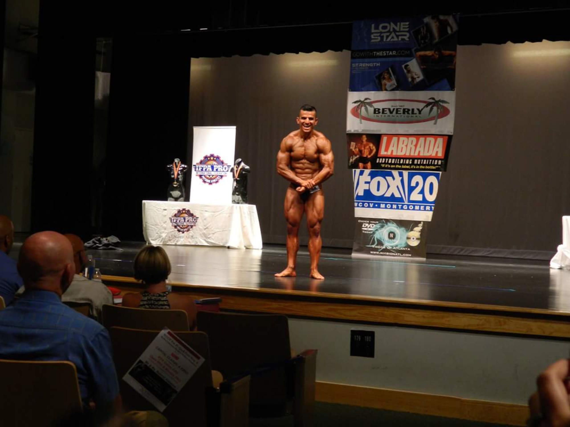 Tech. Sgt. Luis Lopez poses during the International Figure and Physique Association Pro Galaxy Elite Bodybuilding championship at the 19th annual community health fair presented by Baptist Health Rayflex Community Health and Wellness Foundation and 2A Fitness Gym, May 30, 2015, at Carver High School in Montgomery, Alabama. Lopez won Mr. Alabama and qualified to be a professional bodybuilder. (Courtesy photo)