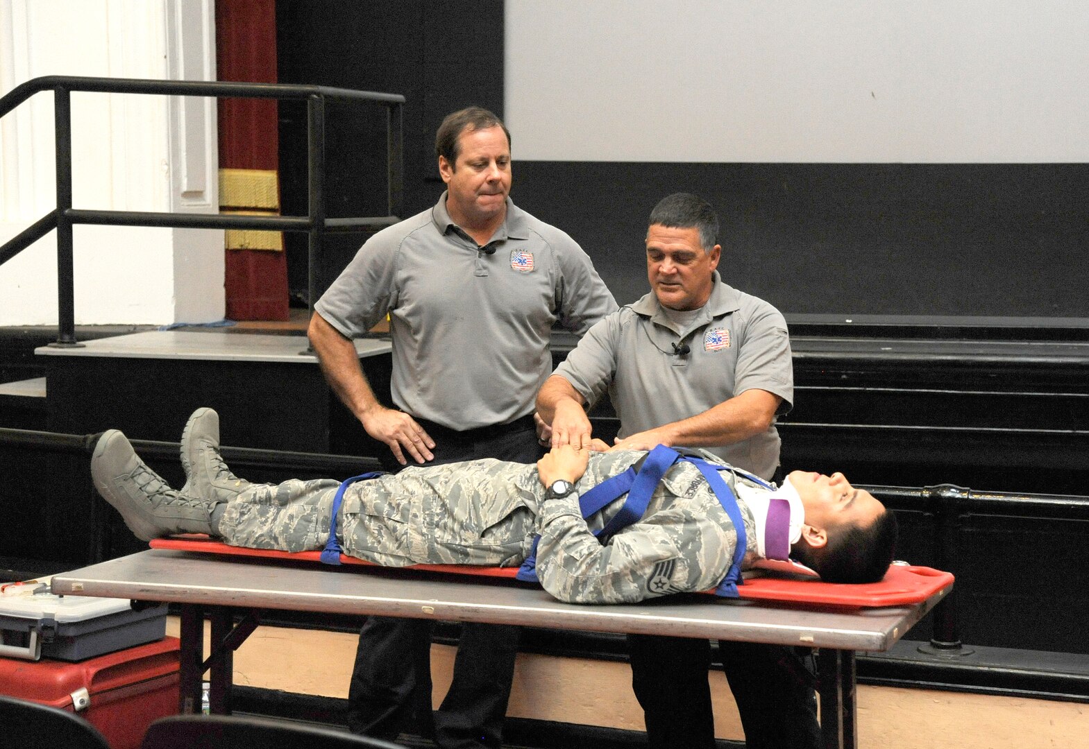Ralph Jimenez (left) and Ronny Garcia, Tampa Fire Department training coordinators, present their “Street Smart” help demonstration highlighting the dangers of driving intoxicated and not wear a seat belt with the help of Staff Sgt. Homero Carrillo, 902nd Security Forces Squadron, during a Wingman Day presentation May 29 at Joint Base San Antonio-Randolph. Wingman Day provides a foundation to build and sustain a culture of comprehensive fit Airman and civilian employees, strengthen resiliency and promotes safety on and off duty. (U.S. Air Force photo by Harold China)