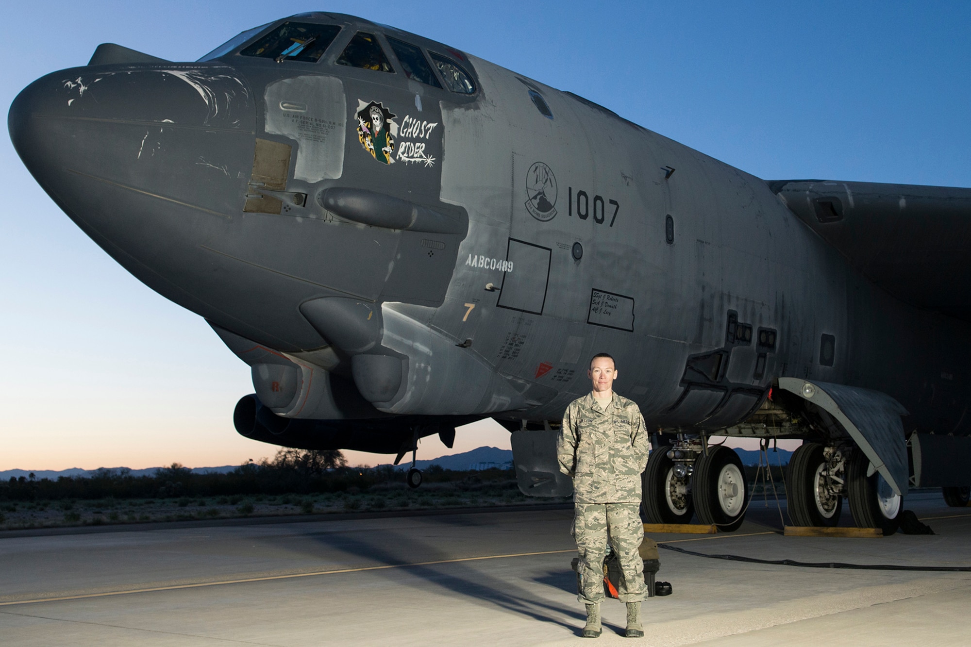 Tech. Sgt. Suann Becton, 507th Maintenance Squadron poses in front of B-52 aircraft number 61-007 which she helped bring back from the Boneyard in both civilian and Air Force Reserve status. The B-52 dubbed the Ghost Rider flew from Davis-Monthan Air Force Base, Ariz., back to Barksdale Air Force Base, La., after the maintenance team brought it back to life. (Courtesy photo/Released)