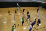 Members of the Air Education and Training Command headquarters volleyball team prepare to return a ball after a strike from the opposite team June 3 during the Joint Base San Antonio intramural volleyball championships at the JBSA-Randolph Rambler Fitness Center.  (U.S. Air Force photo by Senior Airman Alexandria Slade)