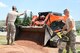 Airmen from the South Dakota Air National Guard’s 114th Civil Engineer Squadron in Sioux Falls, S.D., construct sidewalks across the parade field on Camp Rapid in Rapid City, S.D., June 9, 2015. The project is part of the squadron’s training for the Golden Coyote exercise.(Army National Guard photo by PFC Kristin Lichius/Released)