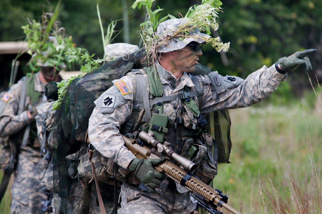 Oklahoma Army National Guard Staff Sgt. Gerald Ritter prepares his squad for a reconnaissance training mission at Lake Elmer Thomas at Fort Sill, Okla., June 1, 2015. The soldiers are assigned to 1st Battalion, 180th Cavalry Squadron, 45th Infantry Brigade Combat Team.
