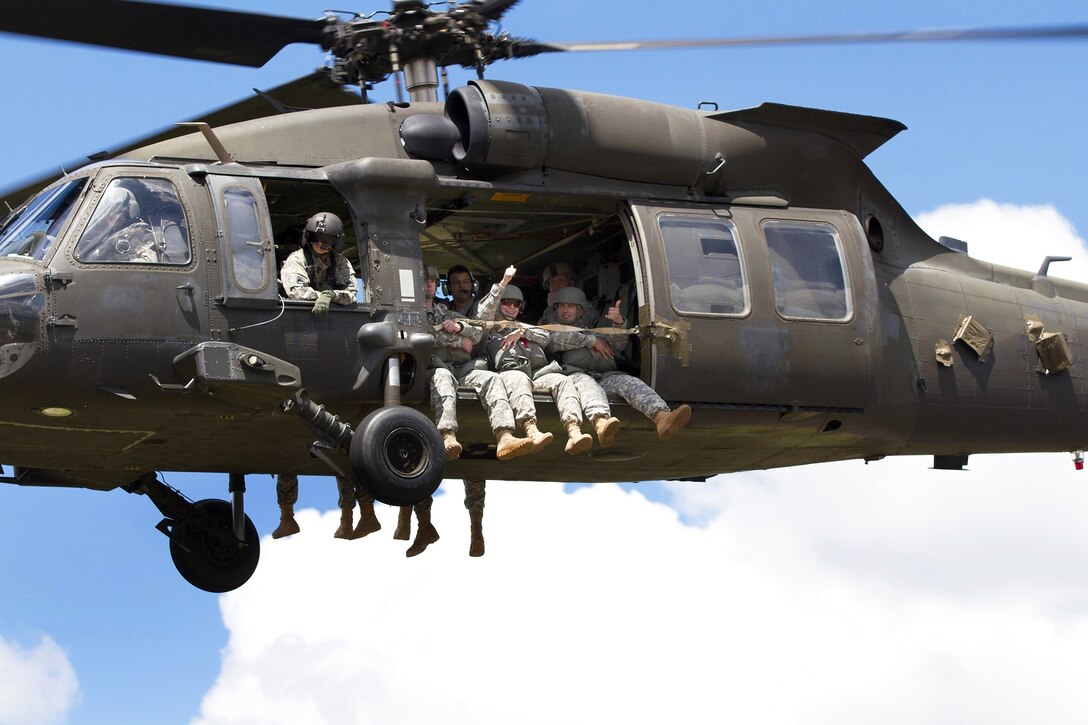 Soldiers from the 1st Special Forces Group prepare to conduct a static-line jump from a UH-60 Black Hawk helicopter at Joint Base Lewis-McChord, Wash., June 4, 2015. The static-line jumps are performed from roughly 1,500 feet.