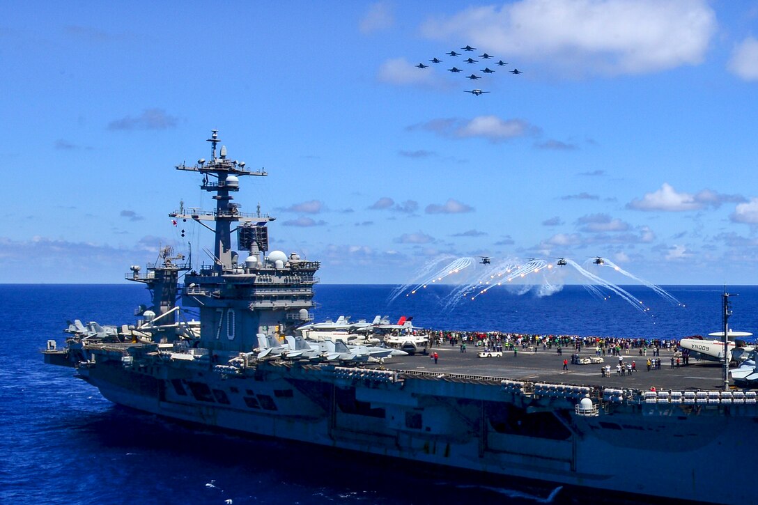 U.S. Navy aircraft assigned to Carrier Air Wing 17 fly in formation during an airpower demonstration above aircraft carrier USS Carl Vinson in the Pacific Ocean, May 31, 2015. The Carl Vinson and its embarked air wing, Carrier Air Wing 17, were in the 3rd Fleet area of operations returning to their home port after a Middle East and Western Pacific deployment.