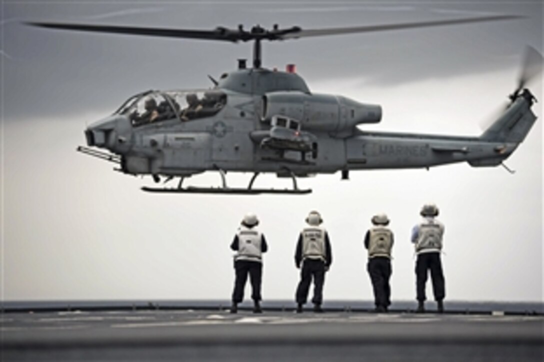 An AH-1W Super Cobra attempts a touch-and-go landing on the flight deck of the dock landing ship USS Ashland in the Pacific Ocean, June 5, 2015. The Super Cobra is assigned to the 31st Marine Expeditionary Unit.