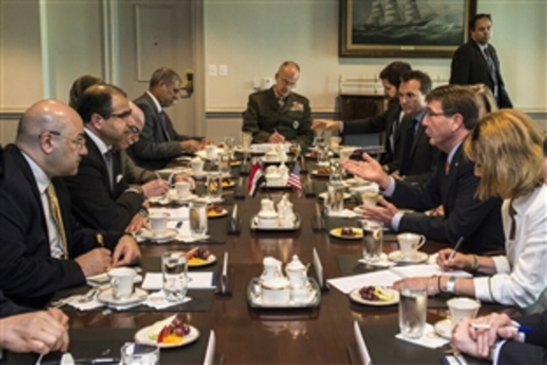 U.S Defense Secretary Ash Carter, second from right, meets with Salim al-Jibouri, second from left, speaker of the Iraqi Council of Representatives, to discuss matters of mutual importance at the Pentagon, June 12, 2015.