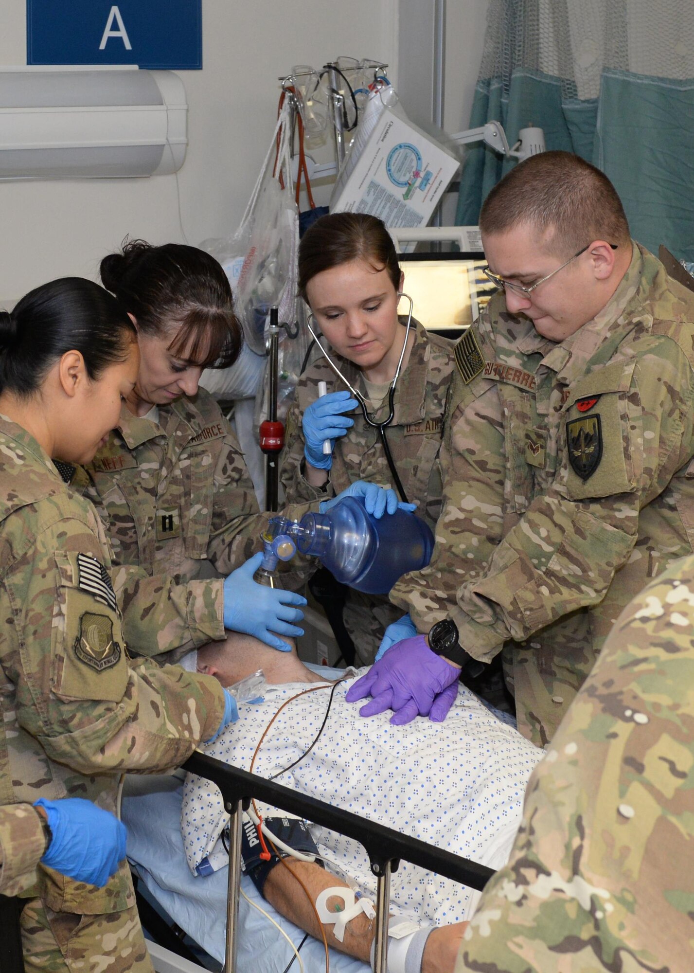 U.S. Air Force Capt. Mavis Bean and her team perform an exercise on a volunteer training patient at the Craig Joint Theatre Hospital June. 11, 2015 at Bagram Airfield, Afghanistan. The team works in the intensive care unit at Afghanistan’s most advanced medical facility, the Craig Joint Theater Hospital, and is responsible for treating trauma patients. (U.S. Air Force photo by Senior Airmen Cierra Presentado/Released)