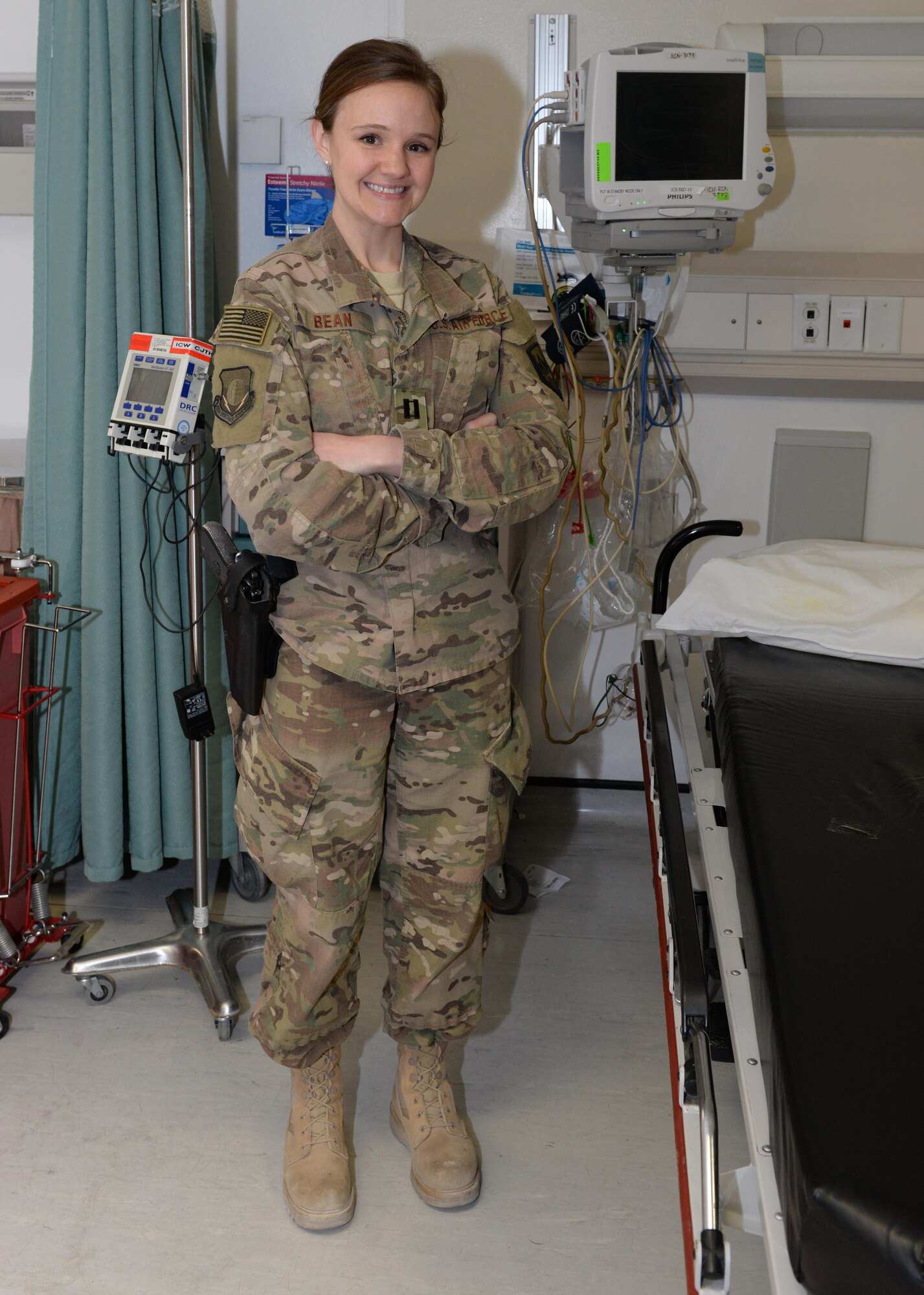 U.S. Air Force Capt. Mavis Bean, 455th Expeditionary Medical Operations Squadron clinical nurse, poses for a photo June 11, 2015, at Bagram Airfield, Afghanistan. Bean works in the intensive care unit at Afghanistan’s most advanced medical facility, the Craig Joint Theater Hospital, and is responsible for treating trauma patients. (U.S. Air Force photo by Senior Airmen Cierra Presentado/Released)